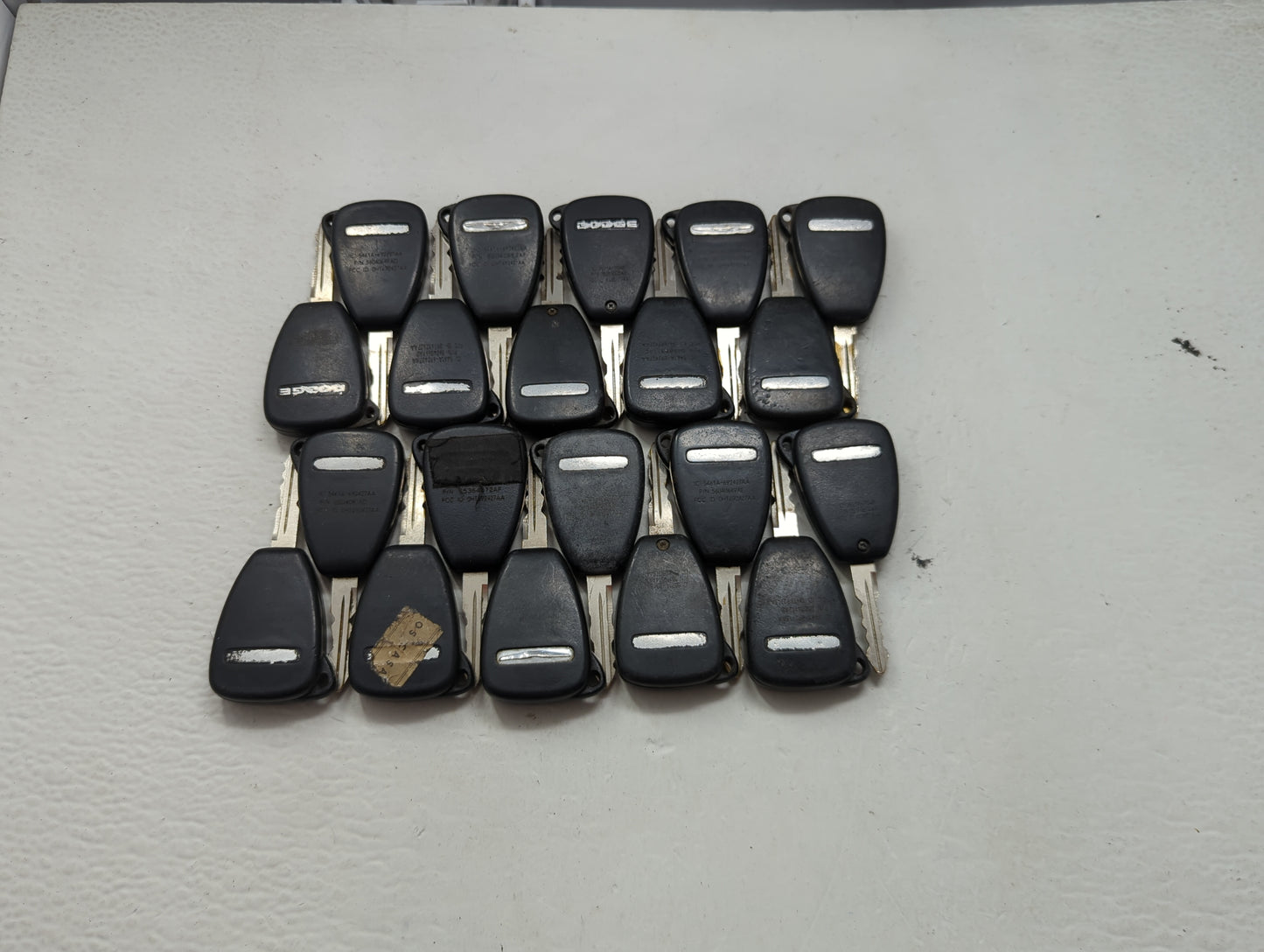 Lot of 20 Dodge Keyless Entry Remote Fob MIXED FCC IDS MIXED PART 1476534 - Oemusedautoparts1.com
