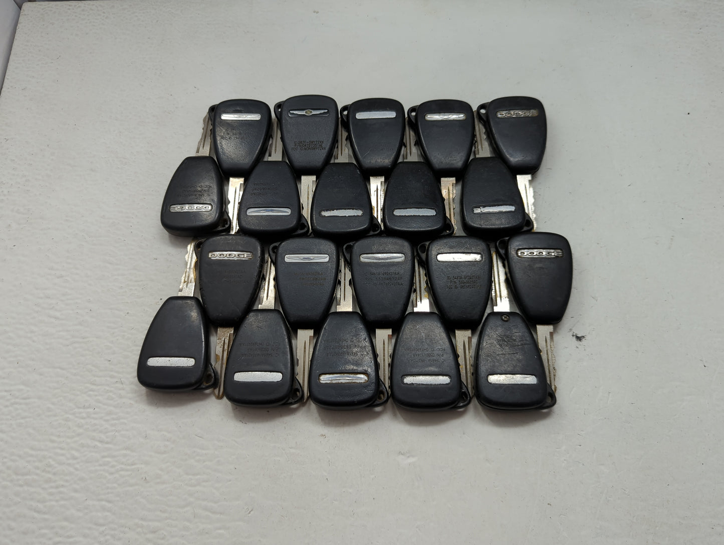 Lot of 20 Dodge Keyless Entry Remote Fob MIXED FCC IDS MIXED PART 1476547 - Oemusedautoparts1.com