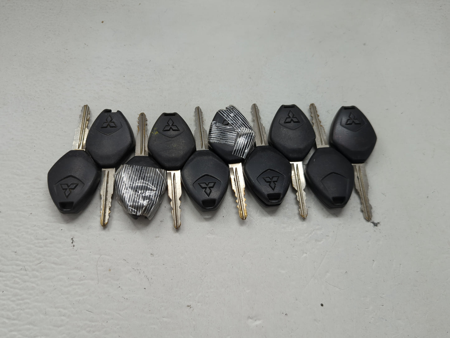 Lot of 10 Mitsubishi Keyless Entry Remote Fob MIXED FCC IDS 1474204 - Oemusedautoparts1.com