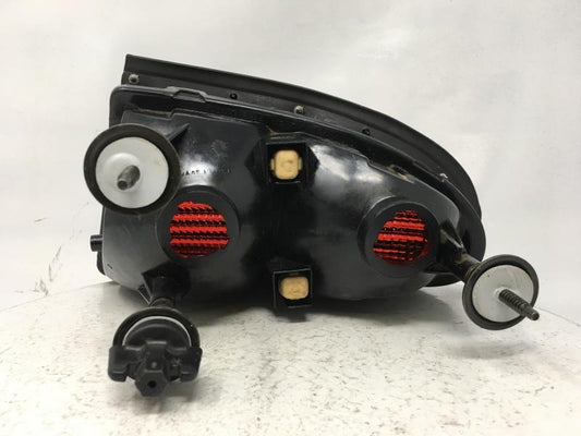 1999 Oldsmobile Aurora Tail Light Assembly Driver Left OEM P/N:QTR PNL MTD DRIVER LEFT Fits Fits 1995 1996 1997 1998 OEM Used Auto Parts