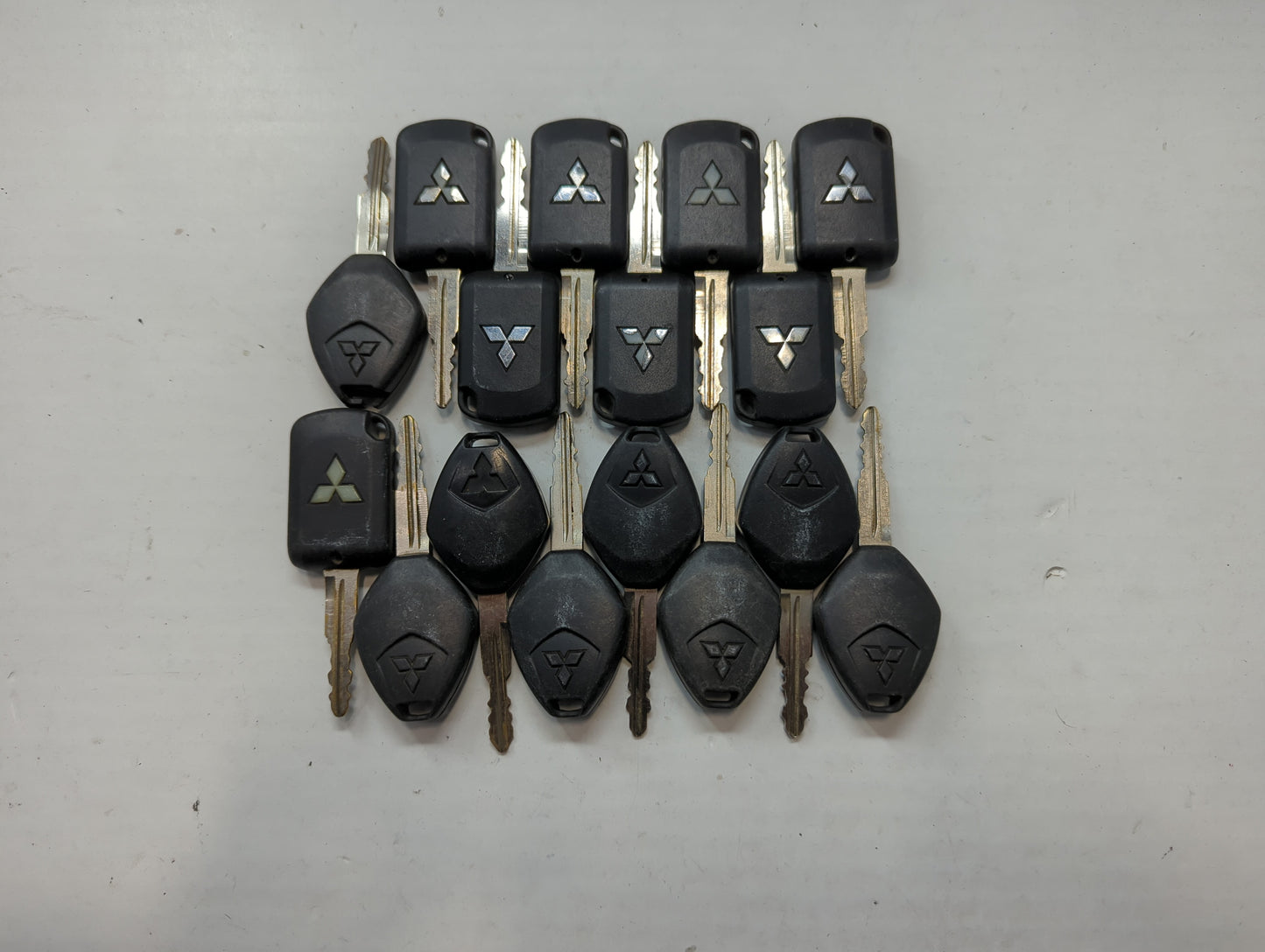Lot of 16 Mitsubishi Keyless Entry Remote Fob MIXED FCC IDS MIXED PART - Oemusedautoparts1.com