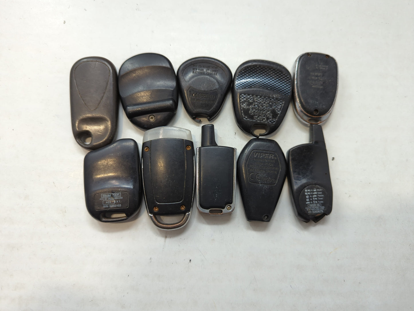 Lot of 10 Aftermarket Keyless Entry Remote Fob MIXED FCC IDS MIXED PART - Oemusedautoparts1.com