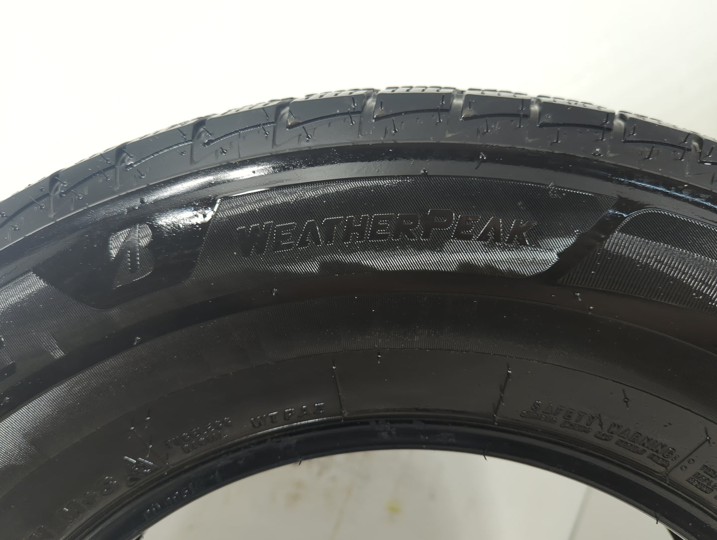 Used Tire 235/70R16 BRIDGESTONE WEATHERPEAK 106H - Tread Depth 7/32 - Oemusedautoparts1.com