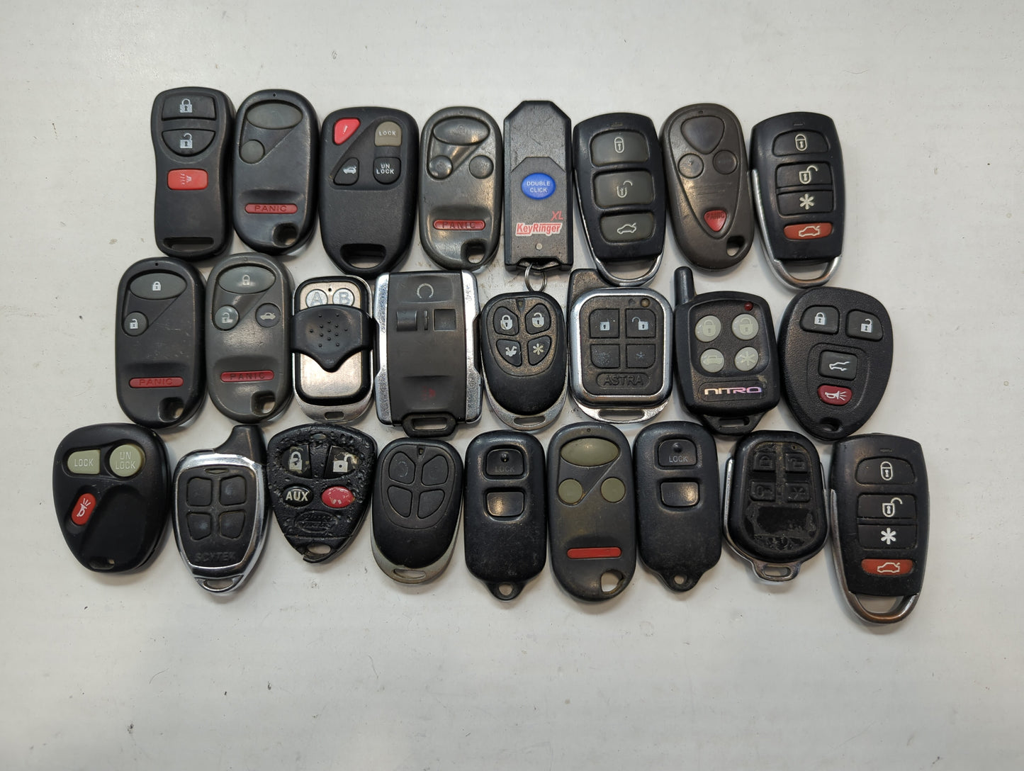 Lot of 25 Aftermarket Keyless Entry Remote Fob MIXED FCC IDS MIXED PART - Oemusedautoparts1.com