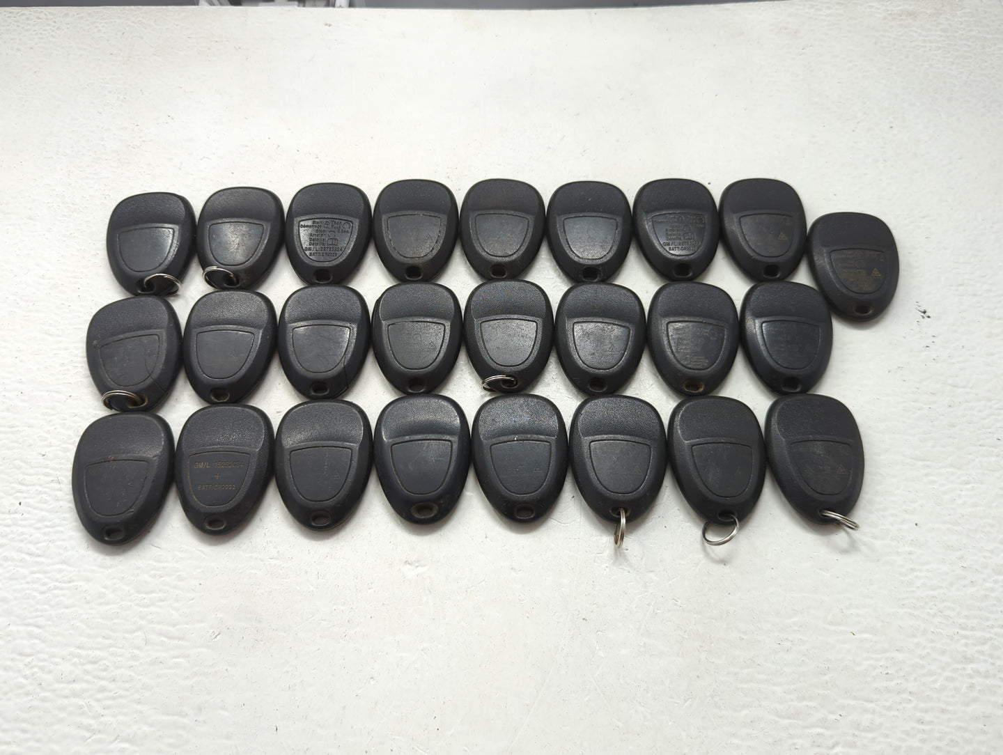 Lot of 25 Chevrolet Keyless Entry Remote Fob MIXED FCC IDS MIXED PART 1476703 - Oemusedautoparts1.com