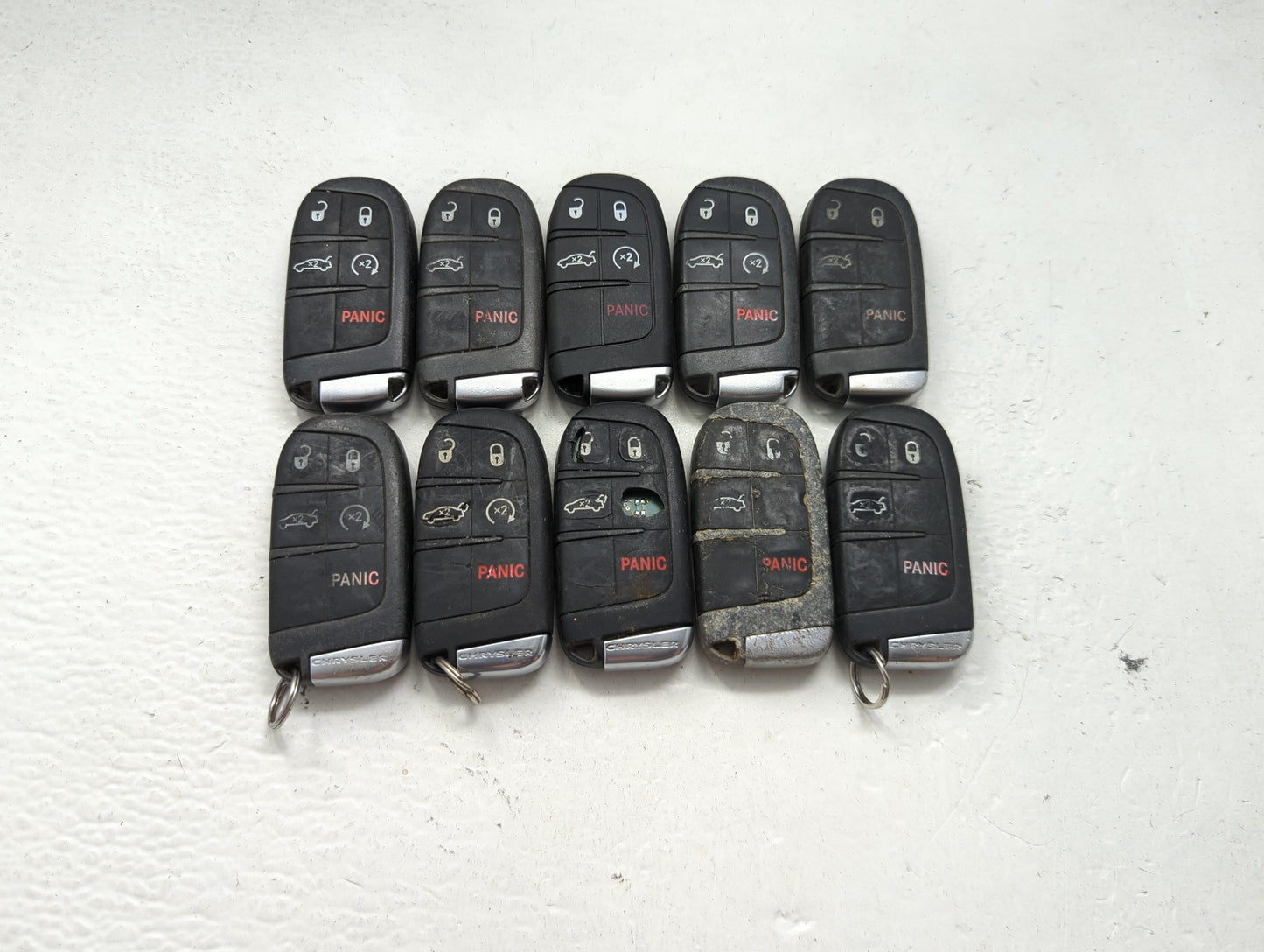 Lot of 10 Chrysler Keyless Entry Remote Fob MIXED FCC IDS MIXED PART 1475772 - Oemusedautoparts1.com