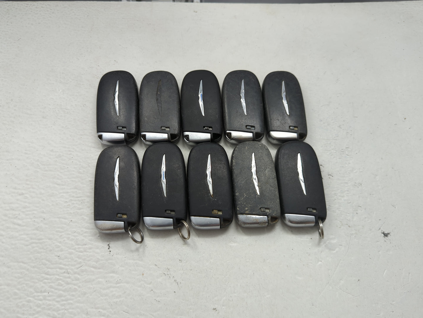 Lot of 10 Chrysler Keyless Entry Remote Fob MIXED FCC IDS MIXED PART 1475772 - Oemusedautoparts1.com