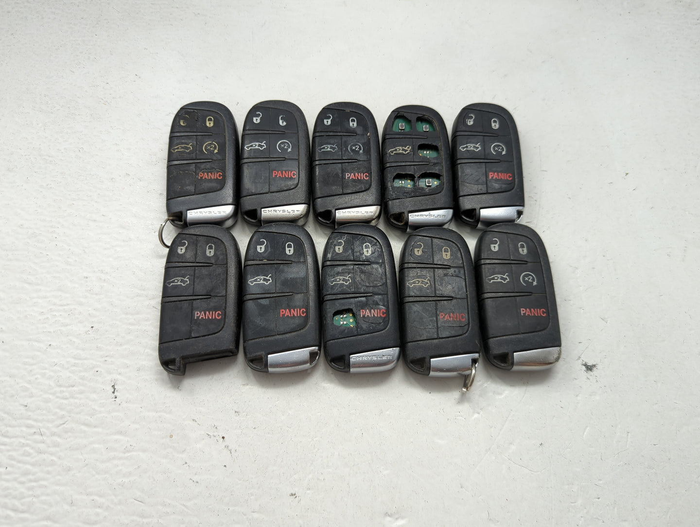 Lot of 10 Chrysler Keyless Entry Remote Fob MIXED FCC IDS MIXED PART 1475773 - Oemusedautoparts1.com
