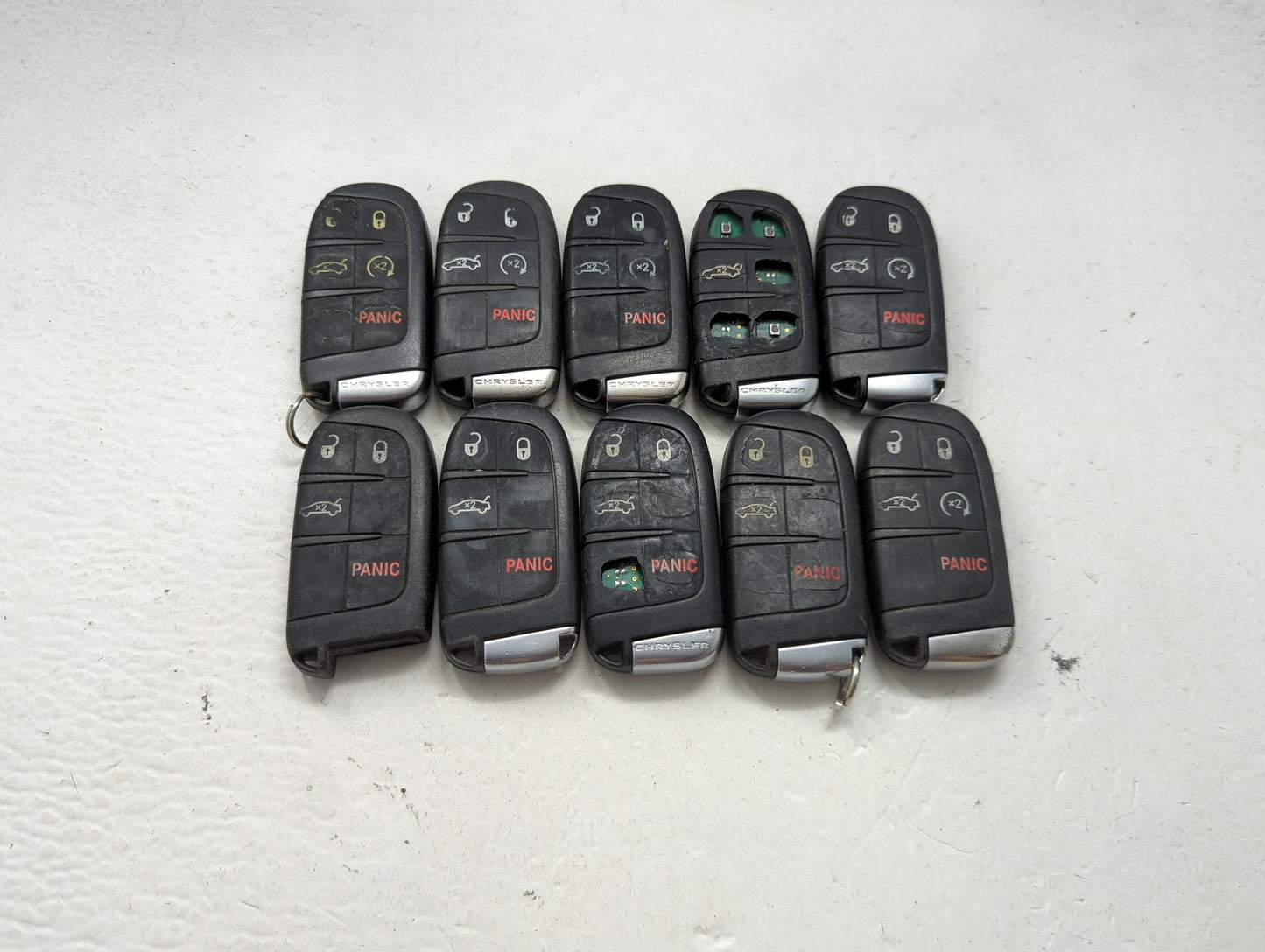 Lot of 10 Chrysler Keyless Entry Remote Fob MIXED FCC IDS MIXED PART 1475773 - Oemusedautoparts1.com