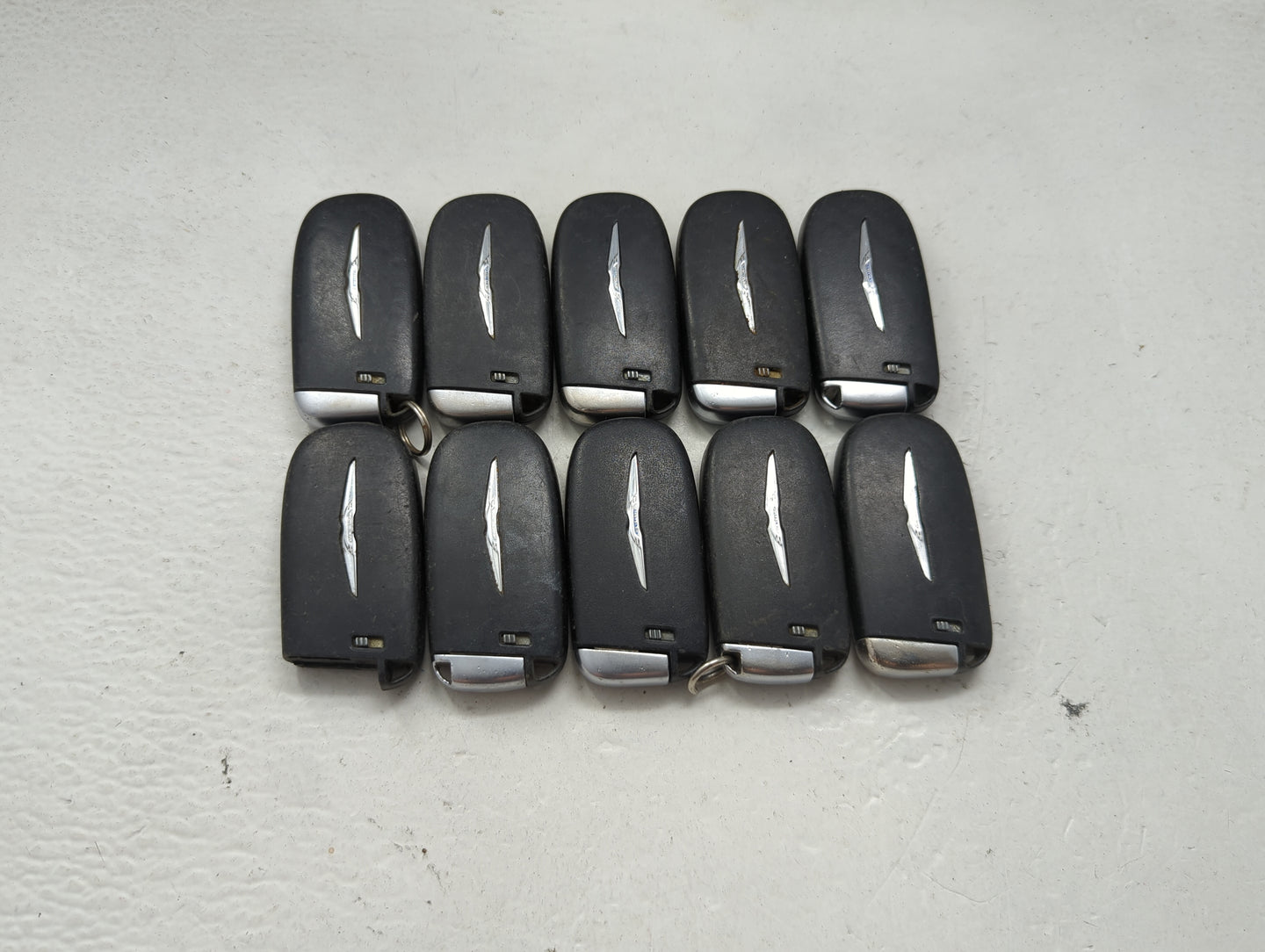 Lot of 10 Chrysler Keyless Entry Remote Fob MIXED FCC IDS MIXED PART 1475773 - Oemusedautoparts1.com