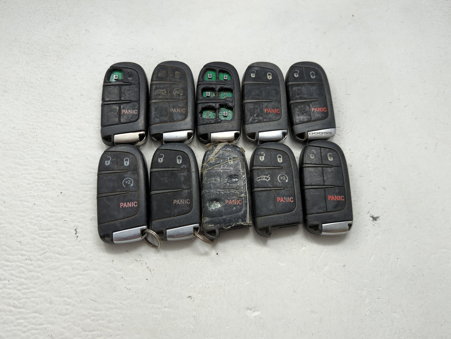 Lot of 10 Dodge Keyless Entry Remote Fob MIXED FCC IDS MIXED PART 1475818 - Oemusedautoparts1.com