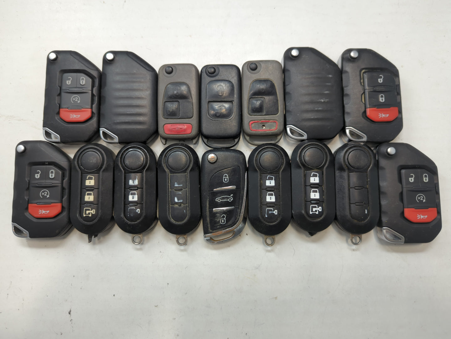 Lot of 16 Dodge Keyless Entry Remote Fob MIXED FCC IDS MIXED PART NUMBERS - Oemusedautoparts1.com