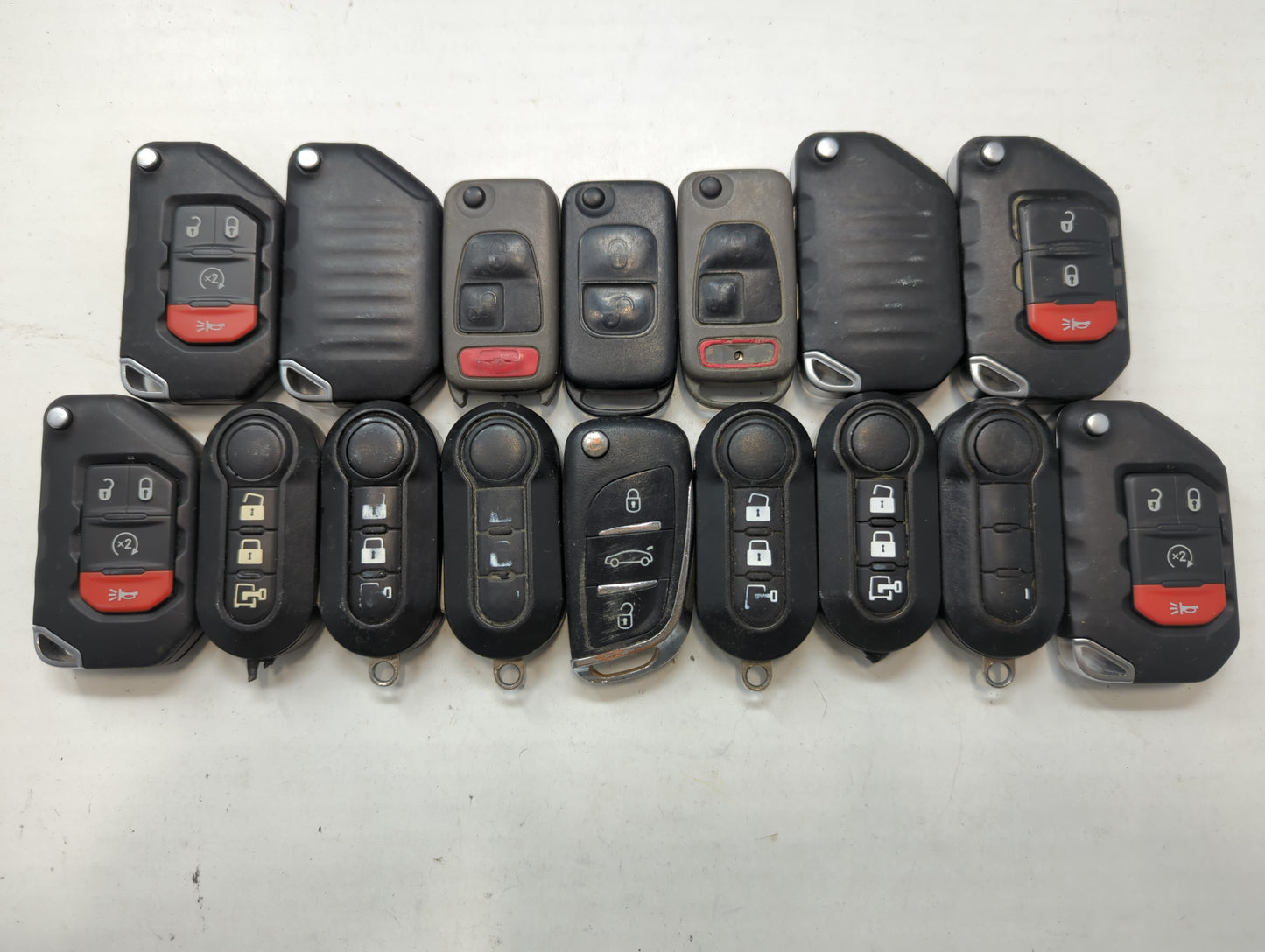 Lot of 16 Dodge Keyless Entry Remote Fob MIXED FCC IDS MIXED PART NUMBERS - Oemusedautoparts1.com