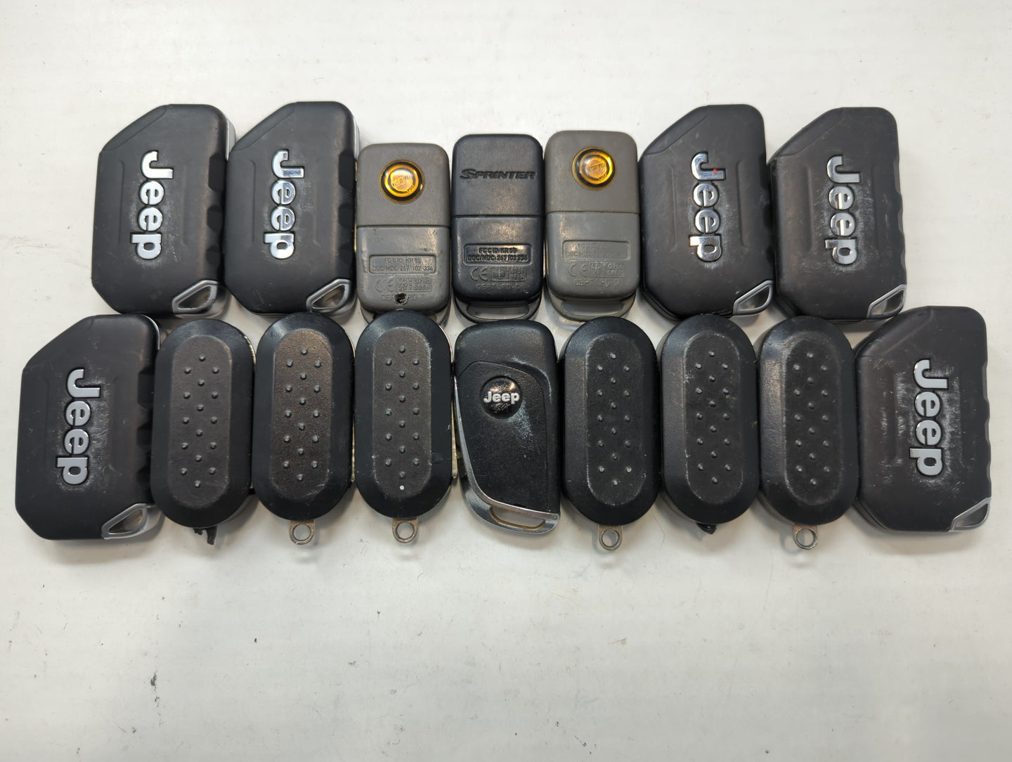 Lot of 16 Dodge Keyless Entry Remote Fob MIXED FCC IDS MIXED PART NUMBERS - Oemusedautoparts1.com