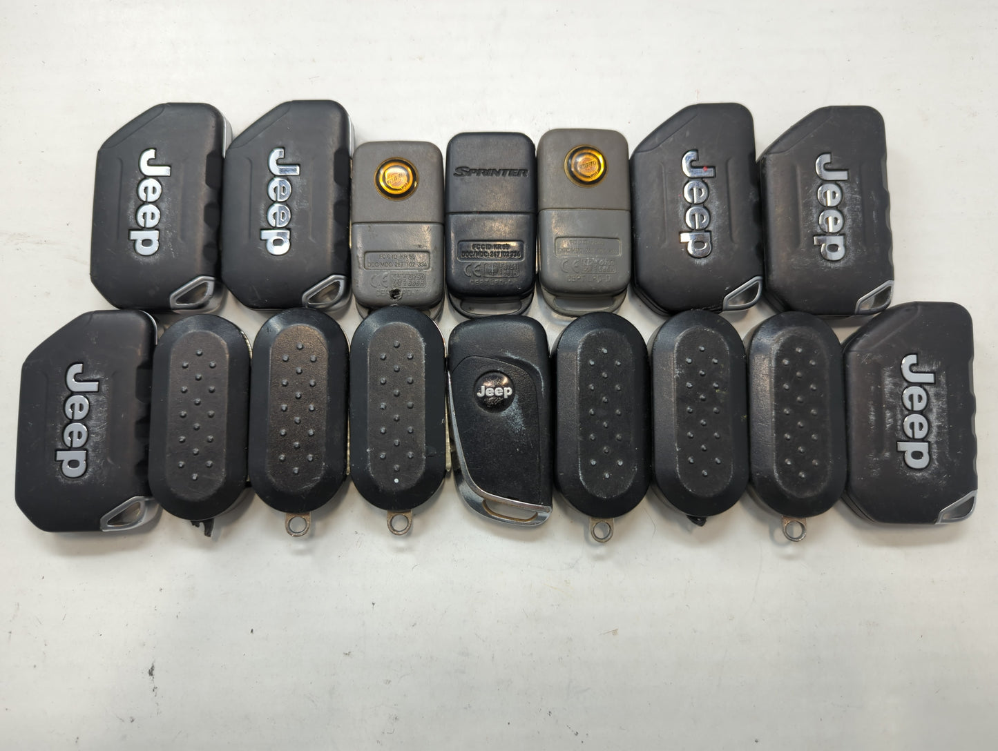 Lot of 16 Dodge Keyless Entry Remote Fob MIXED FCC IDS MIXED PART NUMBERS - Oemusedautoparts1.com