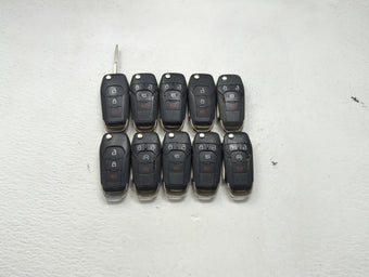 compare product Lot of 10 Ford Keyless Entry Remote Fob MIXED FCC IDS MIXED PART NUMBERS 1476304