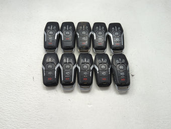 compare product Lot of 10 Ford Keyless Entry Remote Fob MIXED FCC IDS MIXED PART NUMBERS 1476402