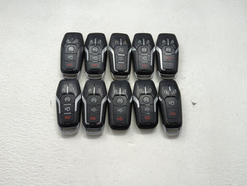 Lot of 10 Ford Keyless Entry Remote Fob MIXED FCC IDS MIXED PART NUMBERS 1476403 - Oemusedautoparts1.com