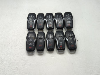 compare product Lot of 10 Ford Keyless Entry Remote Fob MIXED FCC IDS MIXED PART NUMBERS 1476404