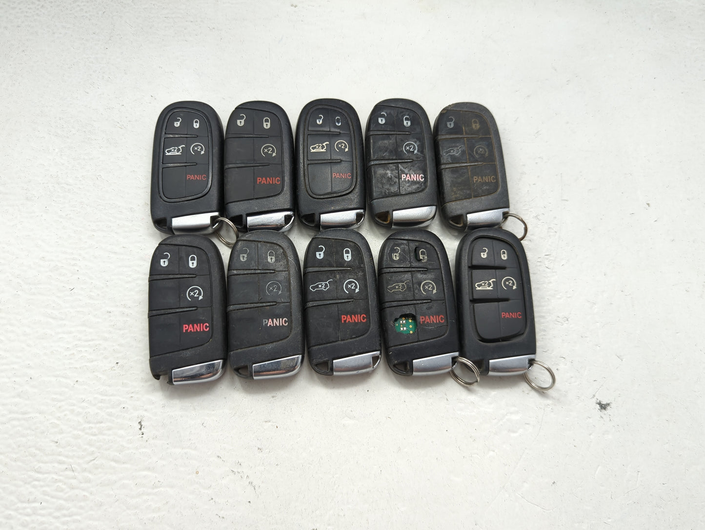 Lot of 10 Jeep Keyless Entry Remote Fob MIXED FCC IDS MIXED PART NUMBERS 1475802 - Oemusedautoparts1.com