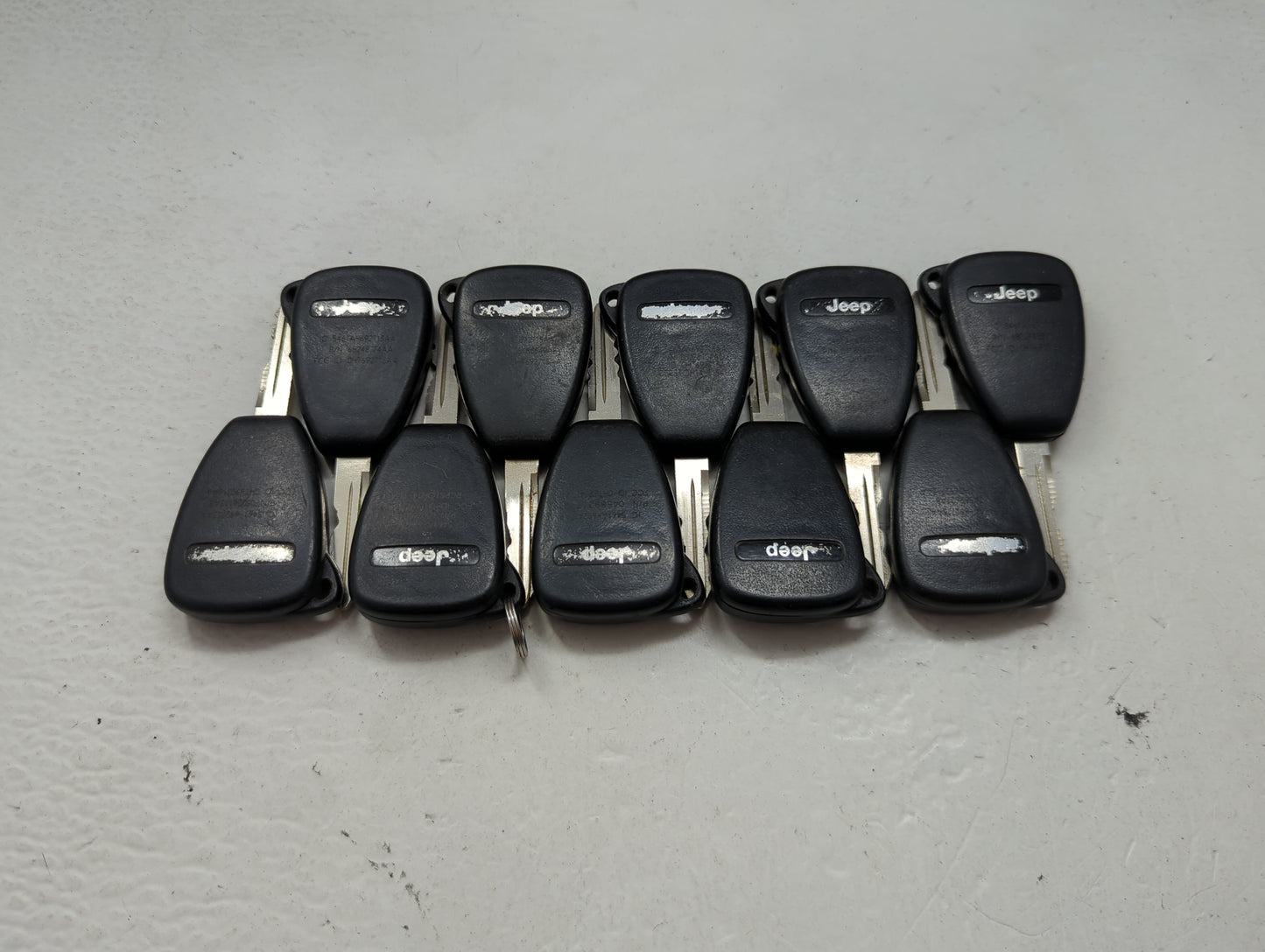 Lot of 10 Jeep Keyless Entry Remote Fob MIXED FCC IDS MIXED PART NUMBERS 1476530 - Oemusedautoparts1.com
