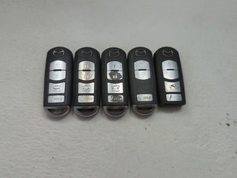 compare product Lot of 5 Mazda Keyless Entry Remote Fob MIXED FCC IDS 1475823