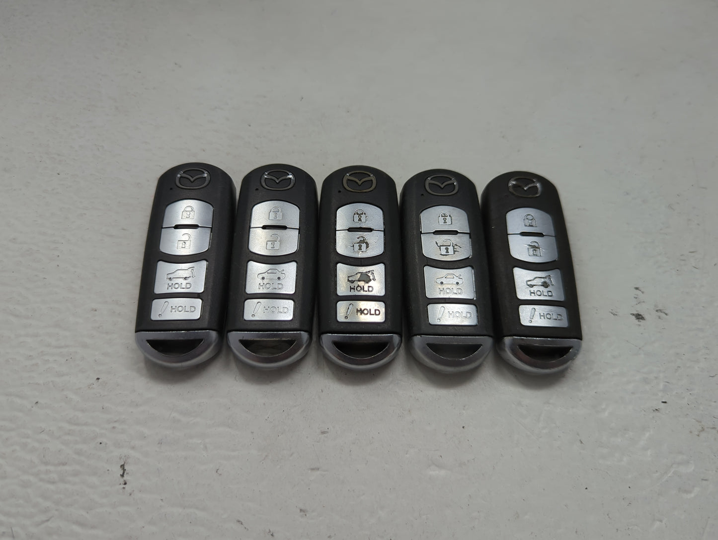 Lot of 5 Mazda Keyless Entry Remote Fob MIXED FCC IDS 1475824 - Oemusedautoparts1.com
