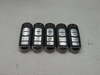 compare product Lot of 5 Mazda Keyless Entry Remote Fob MIXED FCC IDS 1475824