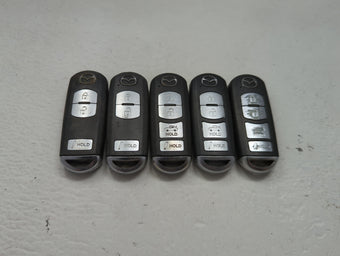 compare product Lot of 5 Mazda Keyless Entry Remote Fob MIXED FCC IDS 1475825