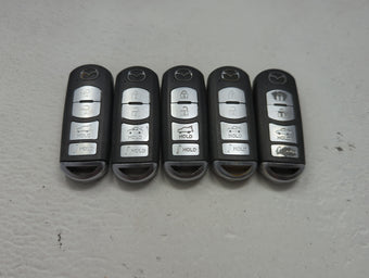 compare product Lot of 5 Mazda Keyless Entry Remote Fob MIXED FCC IDS 1475826