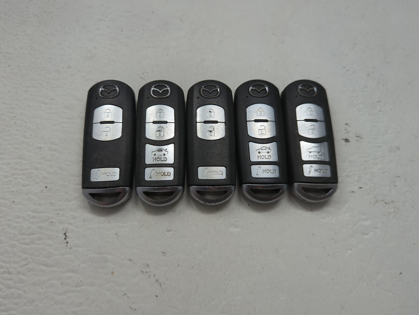 Lot of 5 Mazda Keyless Entry Remote Fob MIXED FCC IDS 1475827 - Oemusedautoparts1.com