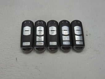 compare product Lot of 5 Mazda Keyless Entry Remote Fob MIXED FCC IDS 1475827