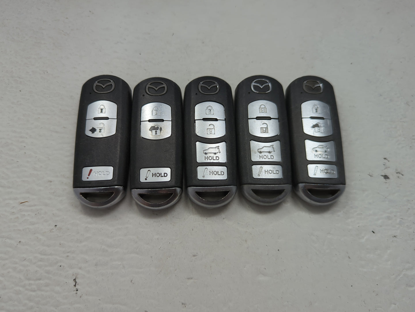 Lot of 5 Mazda Keyless Entry Remote Fob MIXED FCC IDS 1475828 - Oemusedautoparts1.com