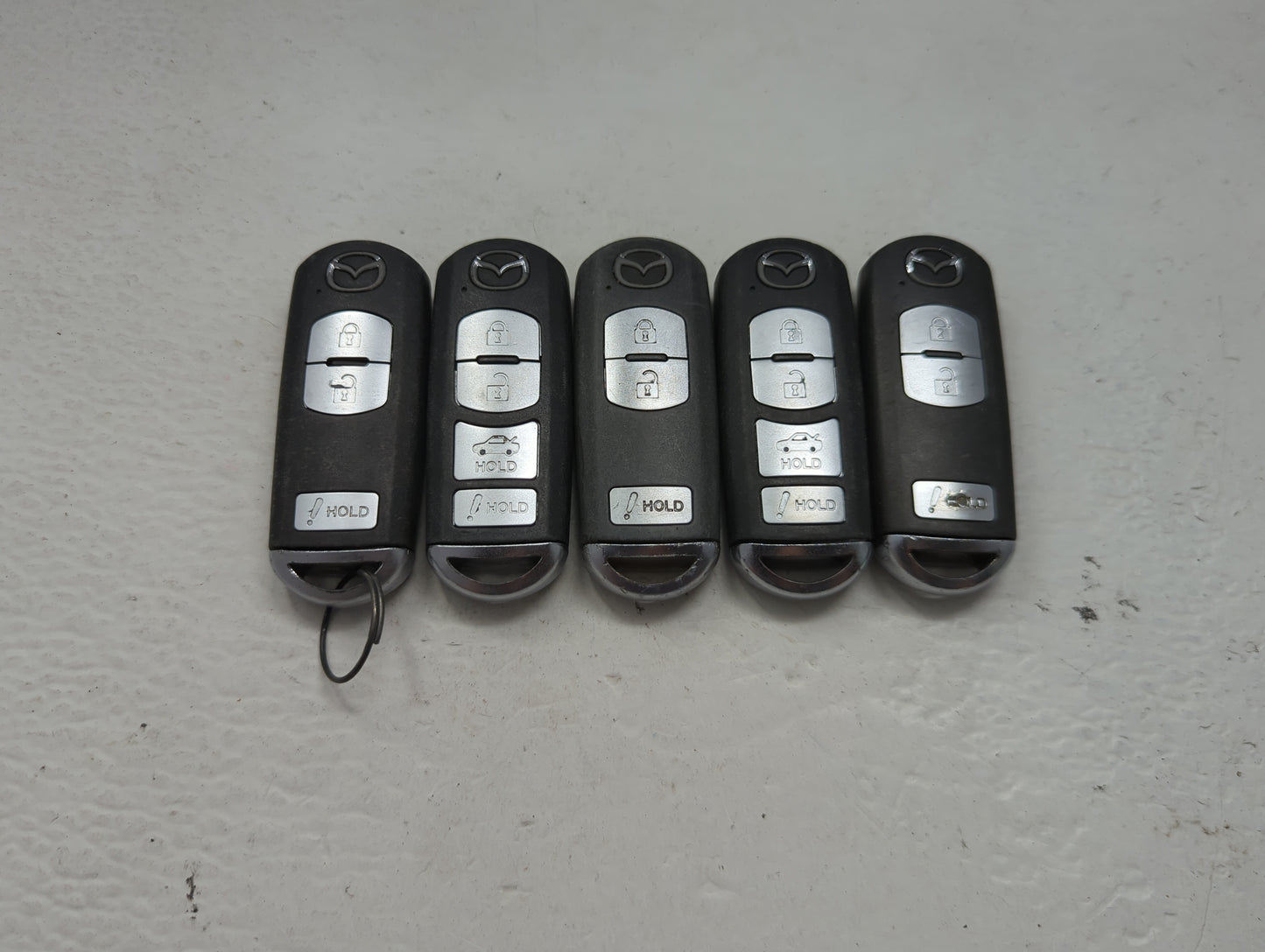 Lot of 5 Mazda Keyless Entry Remote Fob MIXED FCC IDS 1475830 - Oemusedautoparts1.com