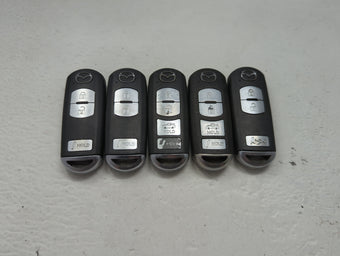 compare product Lot of 5 Mazda Keyless Entry Remote Fob MIXED FCC IDS 1475832