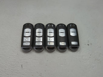 compare product Lot of 5 Mazda Keyless Entry Remote Fob MIXED FCC IDS 1475843