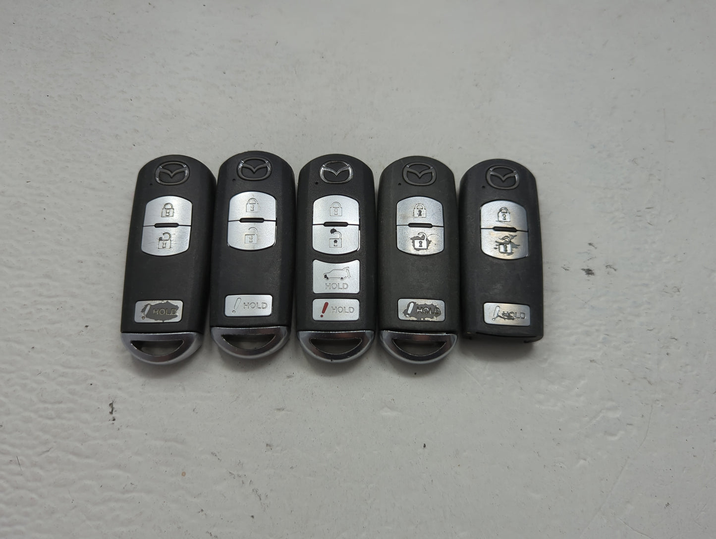 Lot of 5 Mazda Keyless Entry Remote Fob MIXED FCC IDS 1475844 - Oemusedautoparts1.com