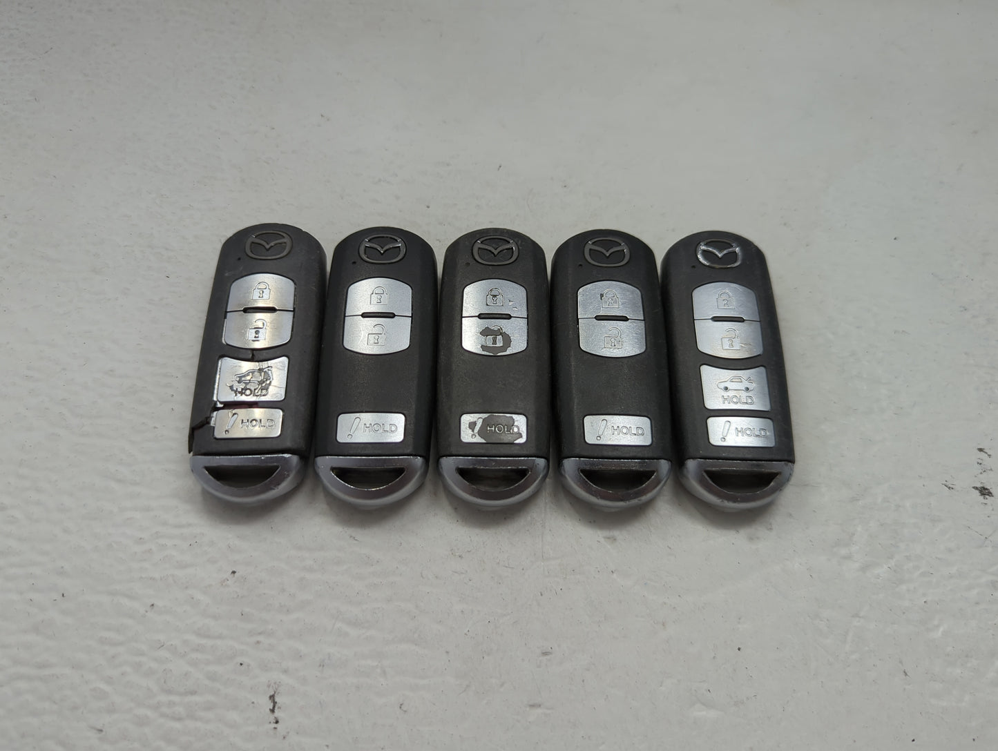 Lot of 5 Mazda Keyless Entry Remote Fob MIXED FCC IDS 1475846 - Oemusedautoparts1.com