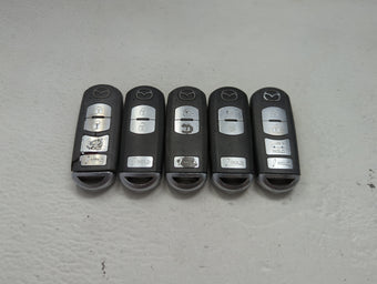 compare product Lot of 5 Mazda Keyless Entry Remote Fob MIXED FCC IDS 1475846