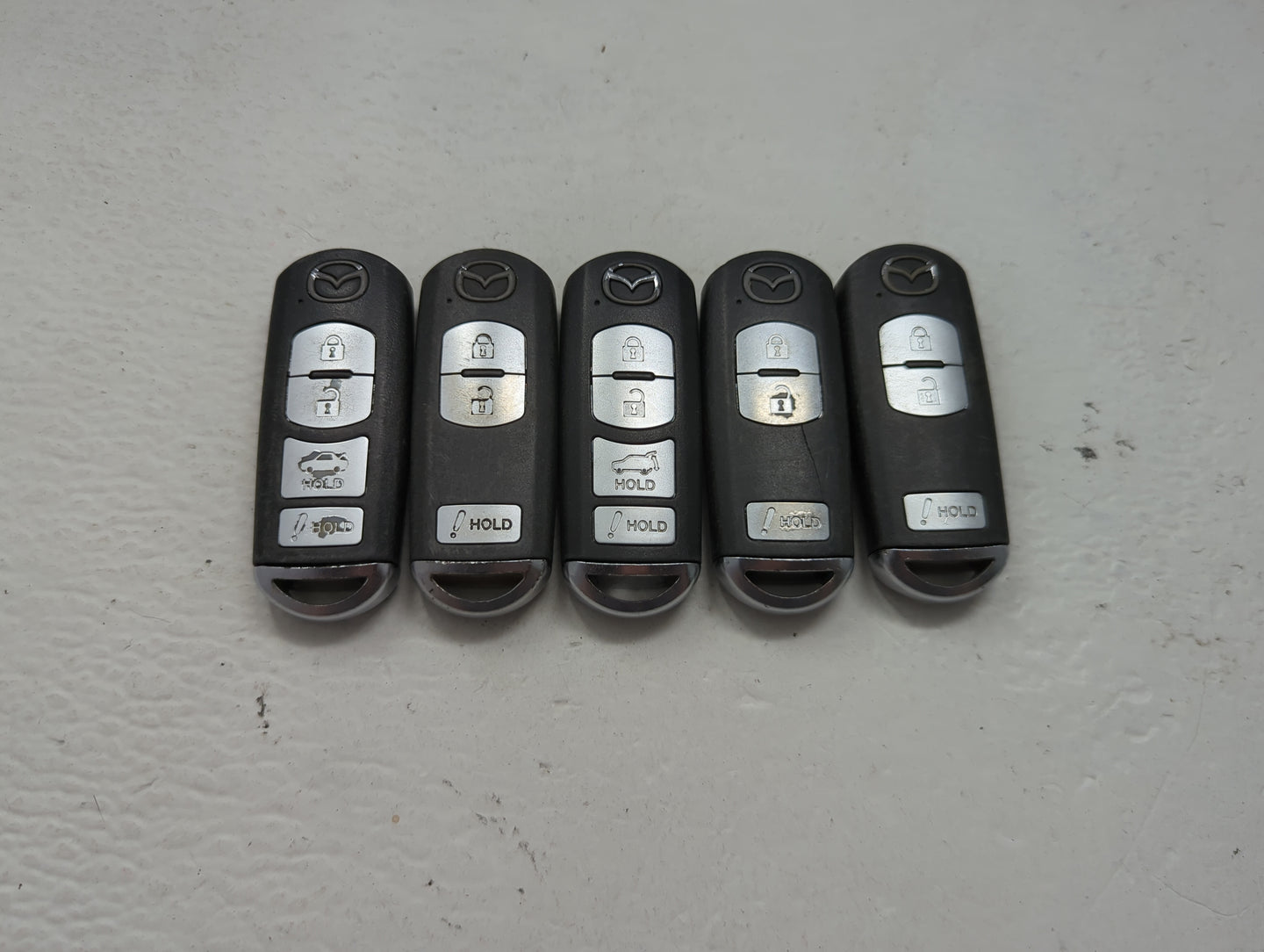 Lot of 5 Mazda Keyless Entry Remote Fob MIXED FCC IDS 1475848 - Oemusedautoparts1.com