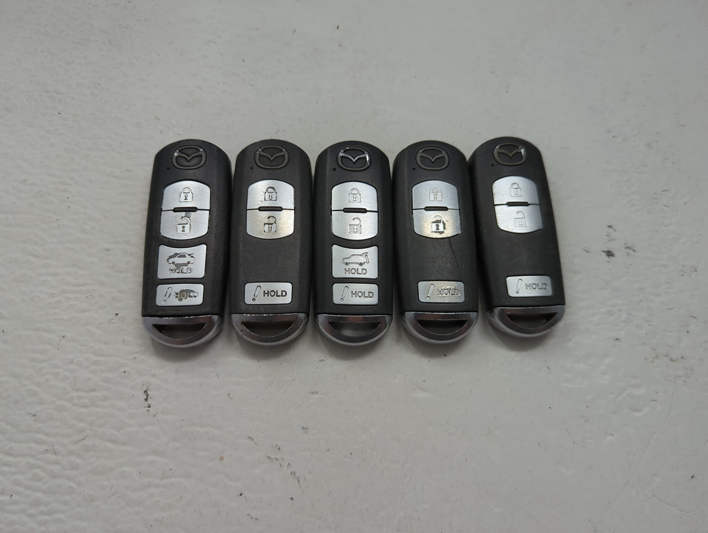 Lot of 5 Mazda Keyless Entry Remote Fob MIXED FCC IDS 1475848 - Oemusedautoparts1.com