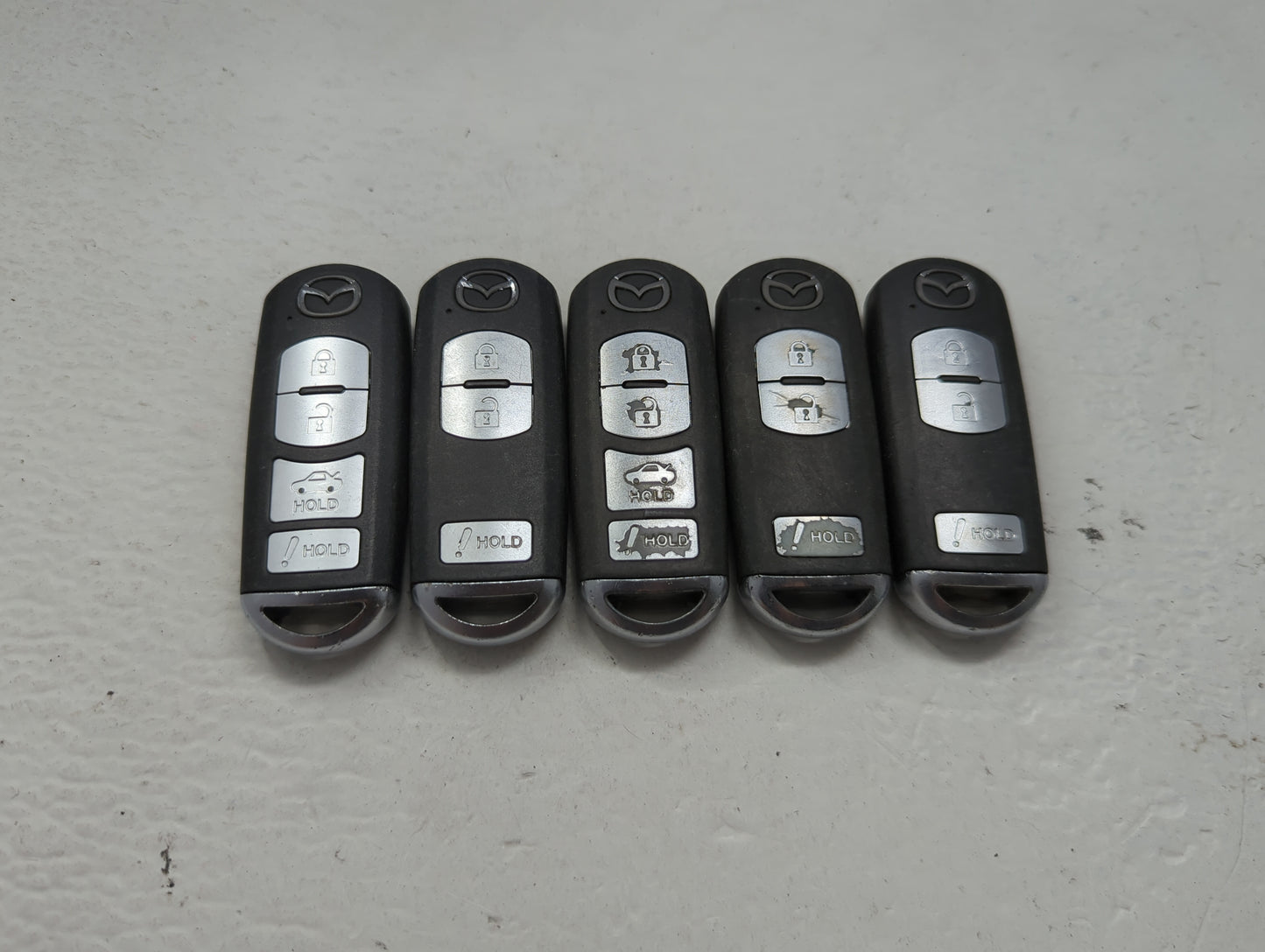 Lot of 5 Mazda Keyless Entry Remote Fob MIXED FCC IDS 1475867 - Oemusedautoparts1.com