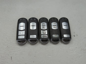 compare product Lot of 5 Mazda Keyless Entry Remote Fob MIXED FCC IDS 1475867