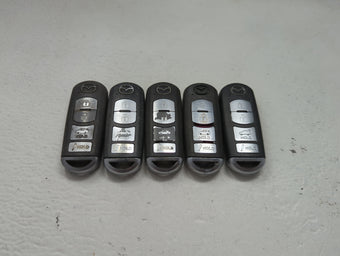 compare product Lot of 5 Mazda Keyless Entry Remote Fob MIXED FCC IDS 1475869