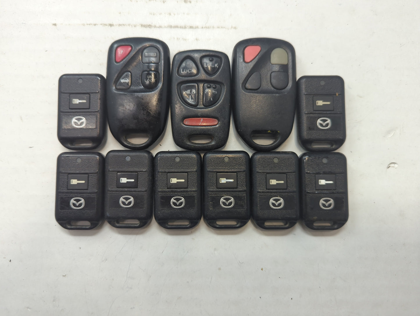 Lot of 11 Mazda Keyless Entry Remote Fob PCMINI | OUCG8D-333A-A | - Oemusedautoparts1.com