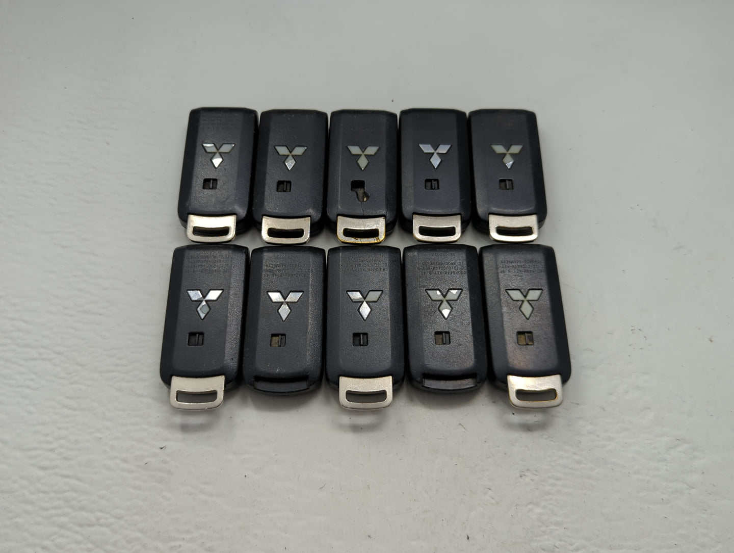 Lot of 10 Mitsubishi Keyless Entry Remote Fob MIXED FCC IDS MIXED PART - Oemusedautoparts1.com