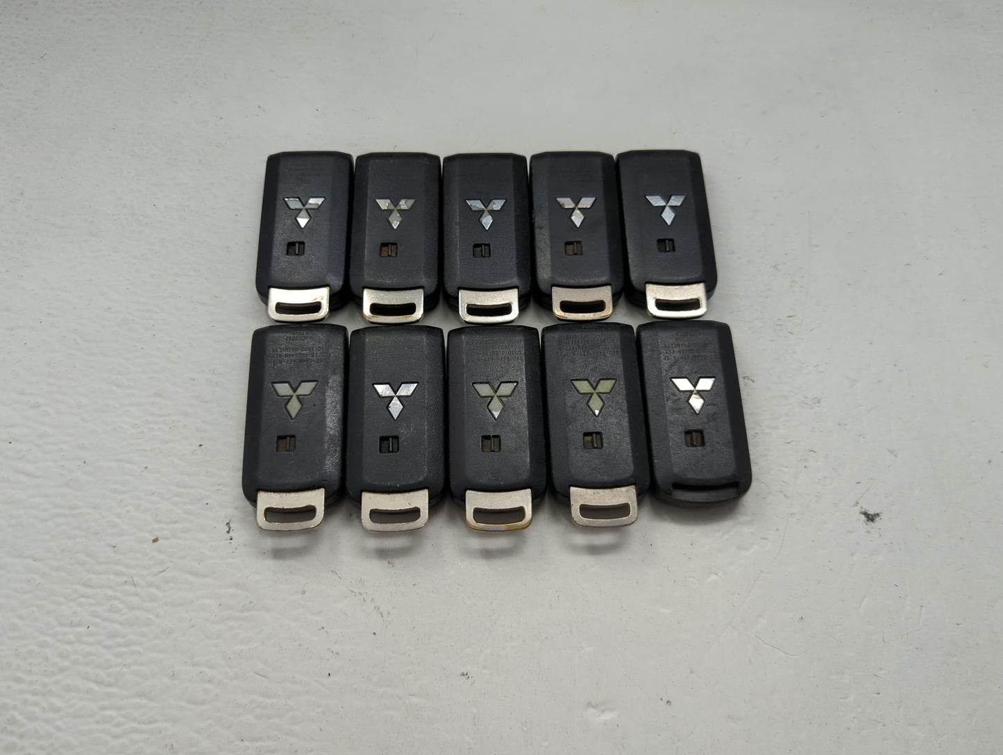 Lot of 10 Mitsubishi Keyless Entry Remote Fob MIXED FCC IDS MIXED PART 1474201 - Oemusedautoparts1.com