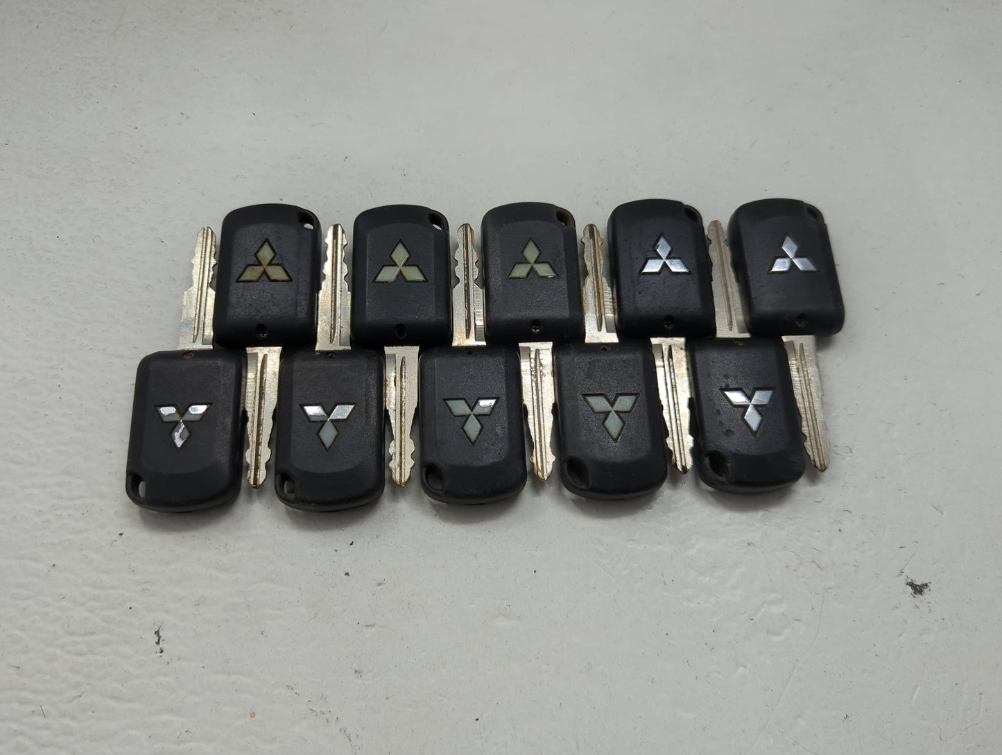 Lot of 10 Mitsubishi Keyless Entry Remote Fob MIXED FCC IDS 1474202 - Oemusedautoparts1.com