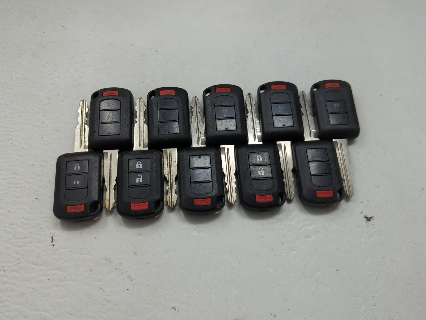 Lot of 10 Mitsubishi Keyless Entry Remote Fob MIXED FCC IDS 1474203 - Oemusedautoparts1.com