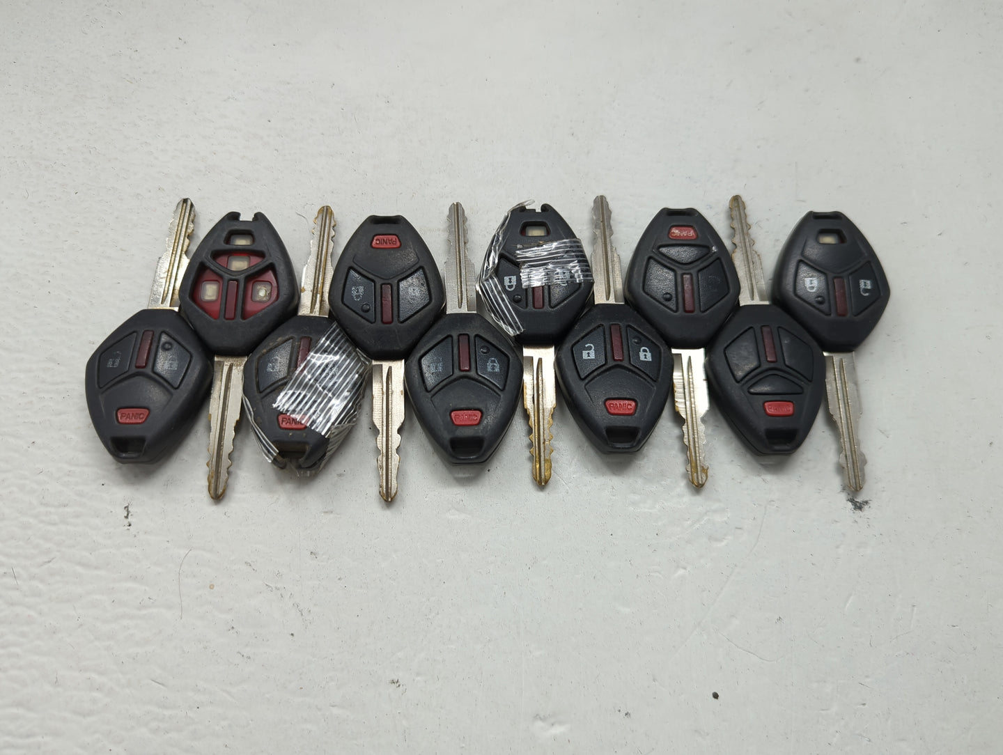Lot of 10 Mitsubishi Keyless Entry Remote Fob MIXED FCC IDS 1474204 - Oemusedautoparts1.com